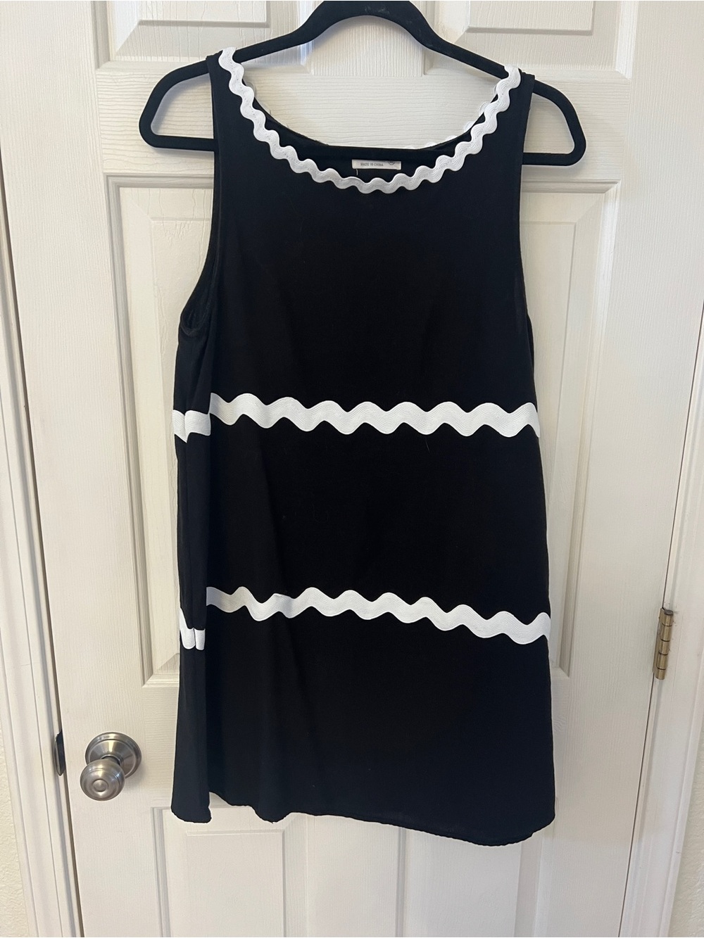 Sleeveless Black Mini Dress with White Wave Trim